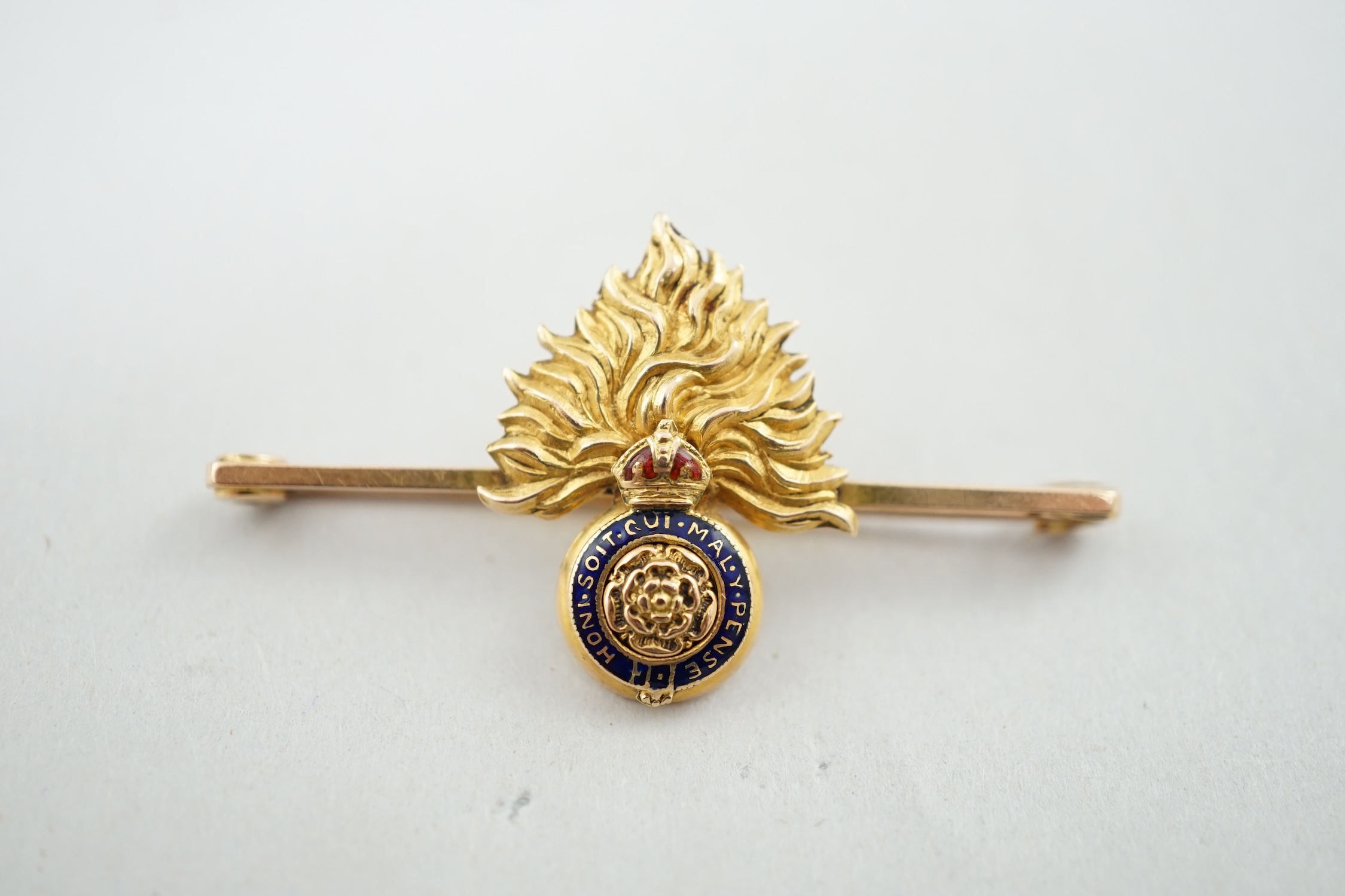 An Edwardian 18ct gold and two colour enamel Royal London Fusiliers sweethearts brooch